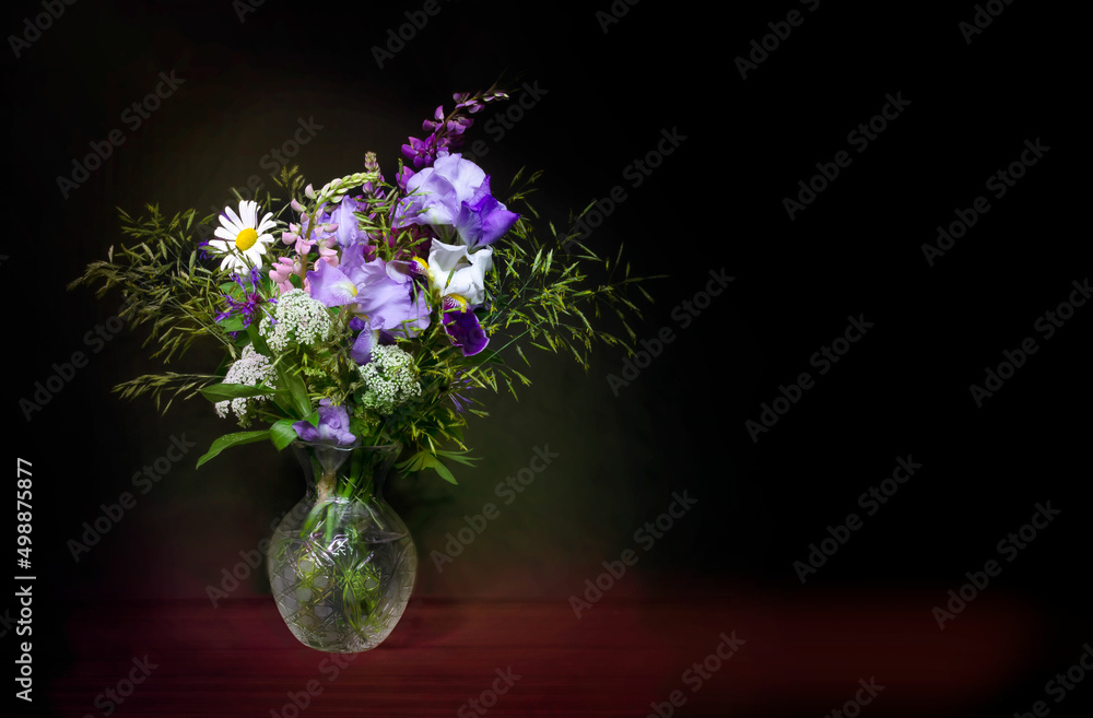 Still life, wildflowers on a dark background. Still life, wildflowers on a dark background.