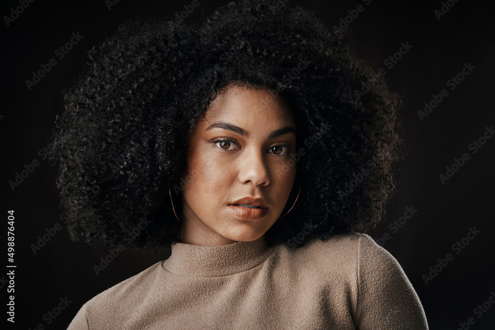 Naturally gorgeous. Cropped portrait of an attractive young woman posing in  studio against a dark background. Photos | Adobe Stock