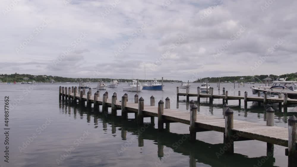 Panning on docked boats at pier on cloudy day Panning on docked boats at pier on cloudy day