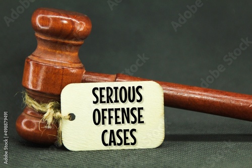 wooden hammers and wooden tags with the words serious offense cases