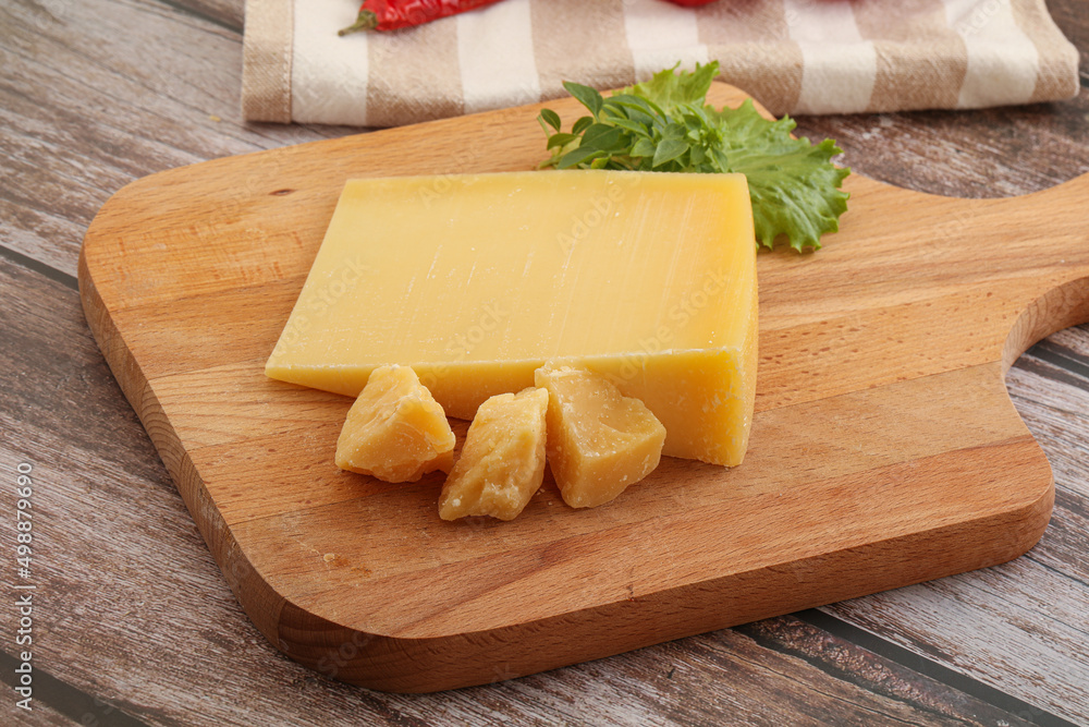 Parmesan hard cheese with small pieces Parmesan hard cheese with small pieces