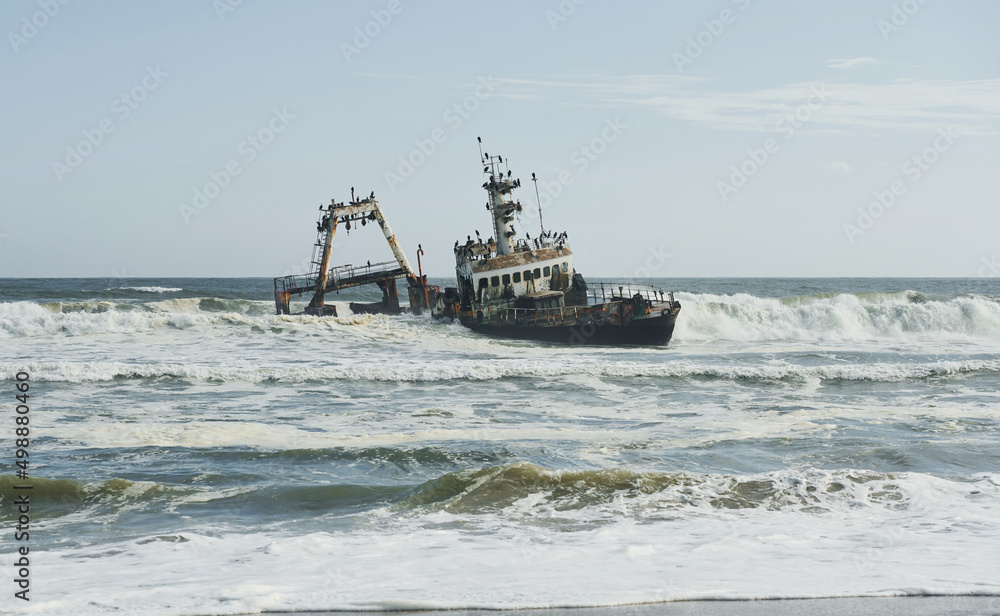 View of abandoned old drowned ship in the sea of Africa