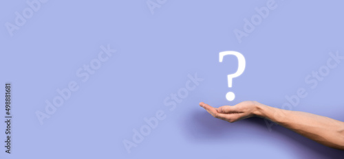 Businessman man hand hold interface question marks sign web. Ask quiestion online, FAQ concept, what where when how and why, search information on internet