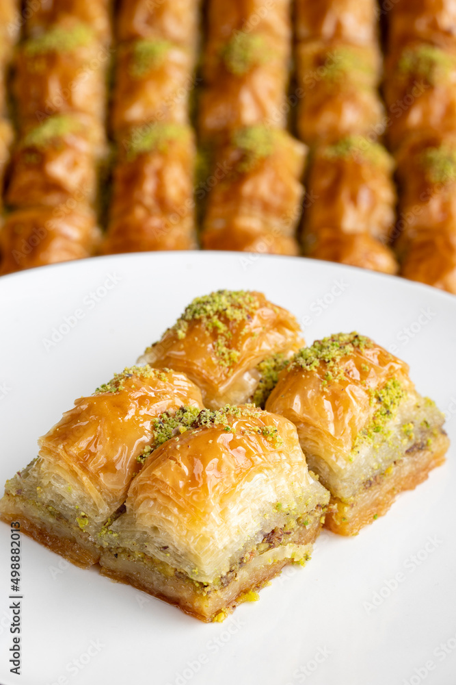 Pistachio baklava. Pistachio baklava in plate. Traditional middle eastern cuisine flavors. Close-up. Pistachio baklava. Pistachio baklava in plate. Traditional middle eastern cuisine flavors. Close-up.