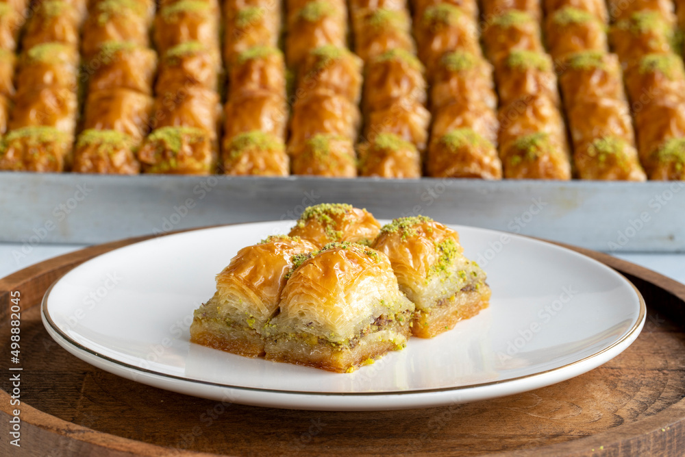 Pistachio baklava. Pistachio baklava in plate. Traditional middle eastern cuisine flavors. Close-up. Pistachio baklava. Pistachio baklava in plate. Traditional middle eastern cuisine flavors. Close-up.