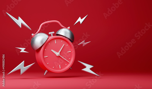 Red vintage ringing alarm clock with silver lightings