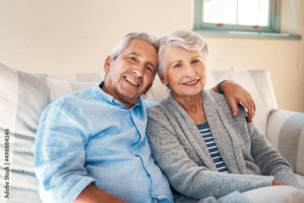 We live well when we love a lot. Shot of a senior couple relaxing together on the sofa at home.