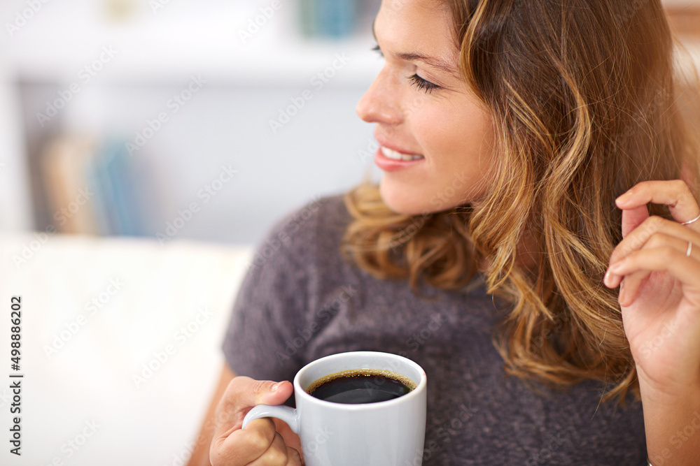 Coffee contemplations.... Shot of a young woman having coffee at home. Coffee contemplations.... Shot of a young woman having coffee at home.