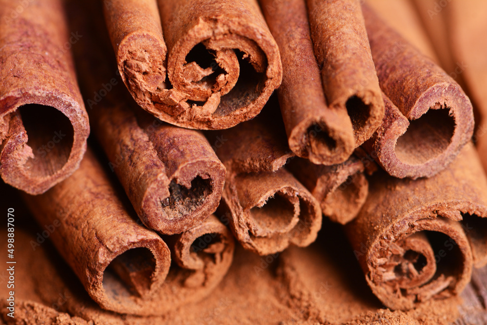 Cinnamon sticks on a wooden background