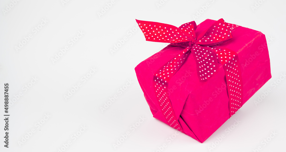  Decorative pink gift box with ribbon isolated white background with copy space. Shopping concept