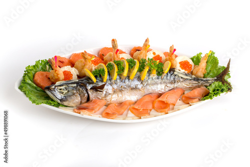 Seafood appetizers on a white background. Sandwiches with a game, a tartlet appetizer with sauce and red caviar, sliced red salmon fish and cream sauce with scrambled eggs.