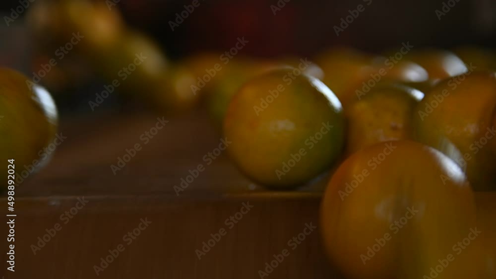 Oranges on the conveyor belt falling fast Oranges on the conveyor belt falling fast