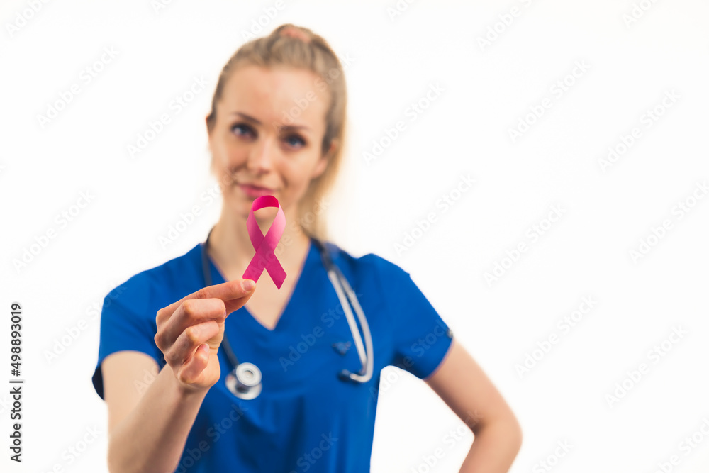 Protection from AIDS campaign. Healthcare professional female worker in a blue uniform holding red ribbon with her fingers. Medium studio shot. High quality photo Protection from AIDS campaign. Healthcare professional female worker in a blue uniform holding red ribbon with her fingers. Medium studio shot. High quality photo