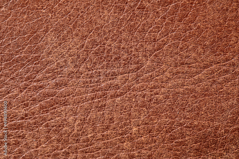 leather grunge background: a piece of light brown leather, with scuffs, spots, scars leather grunge background: a piece of light brown leather, with scuffs, spots, scars