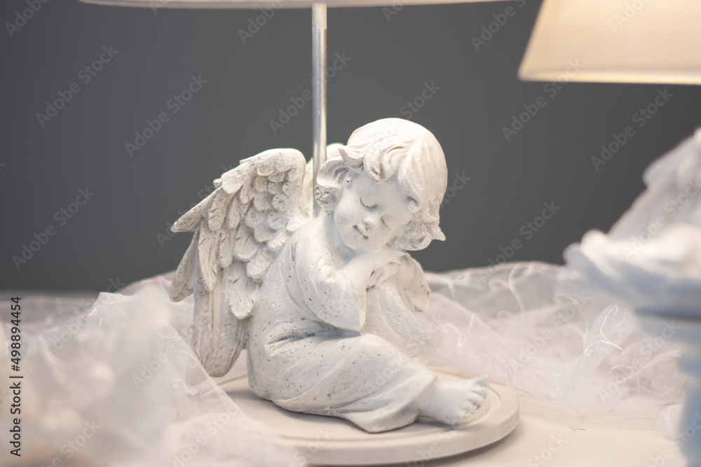 handmade floor lamp with an angel