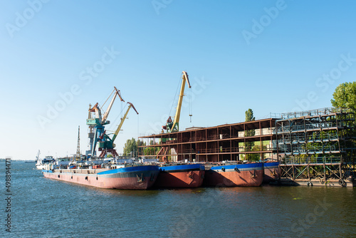 dry cargo ships moored for repair at a shipyard
