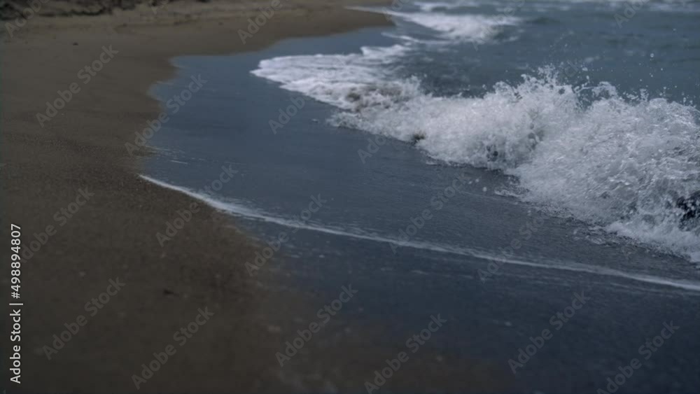 Blue waves crashing sea shoreline on sand beach landscape. Wild nature concept. Blue waves crashing sea shoreline on sand beach landscape. Wild nature concept.