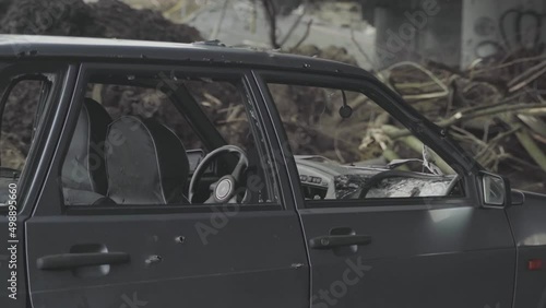 Irpin. Ukraine. 03.10.2022. Abandoned shot cars. War in Ukraine. The bombing of the city, the evacuation of residents. photo