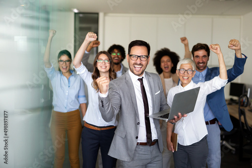 Obraz na plátně Happy group of business team celebrating a good job in the office