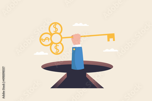 The key to success. Unlock job duties. Unlock freedom or life. Businessman hand holding a large key to unlock something.