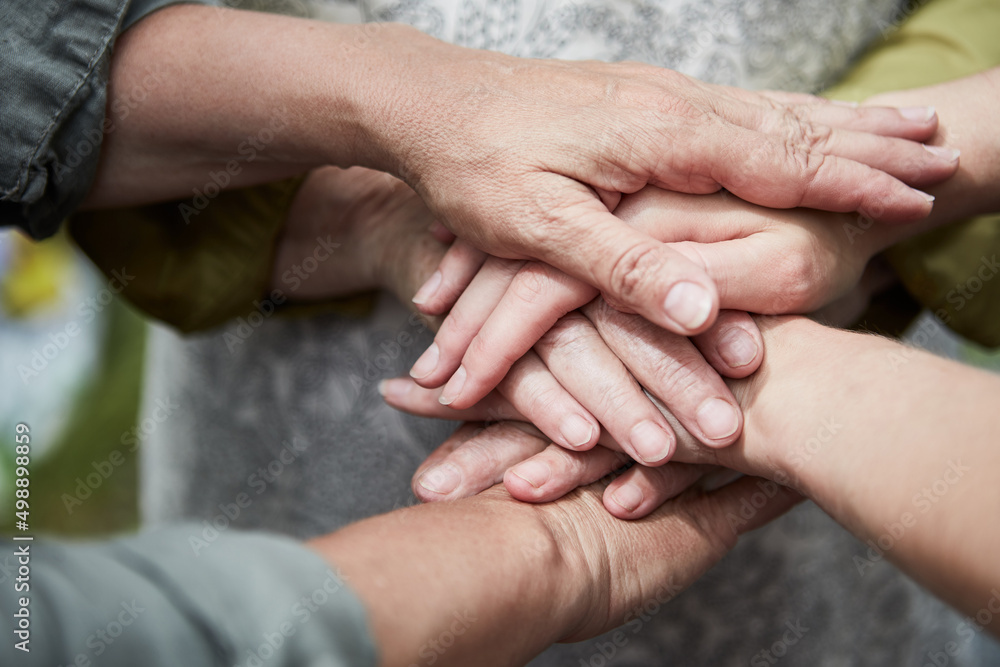 Team stacks hands for team spirit and motivation Team stacks hands for team spirit and motivation