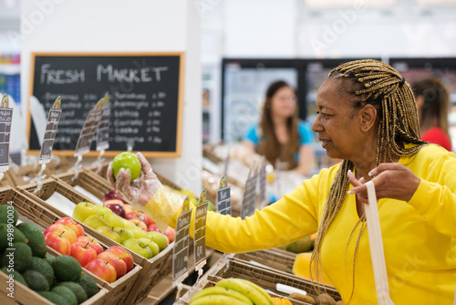 Senior woman shopping for fruits and vegetables