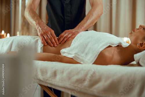 Photos Alternative medicine male therapist doing relaxing massage to female client