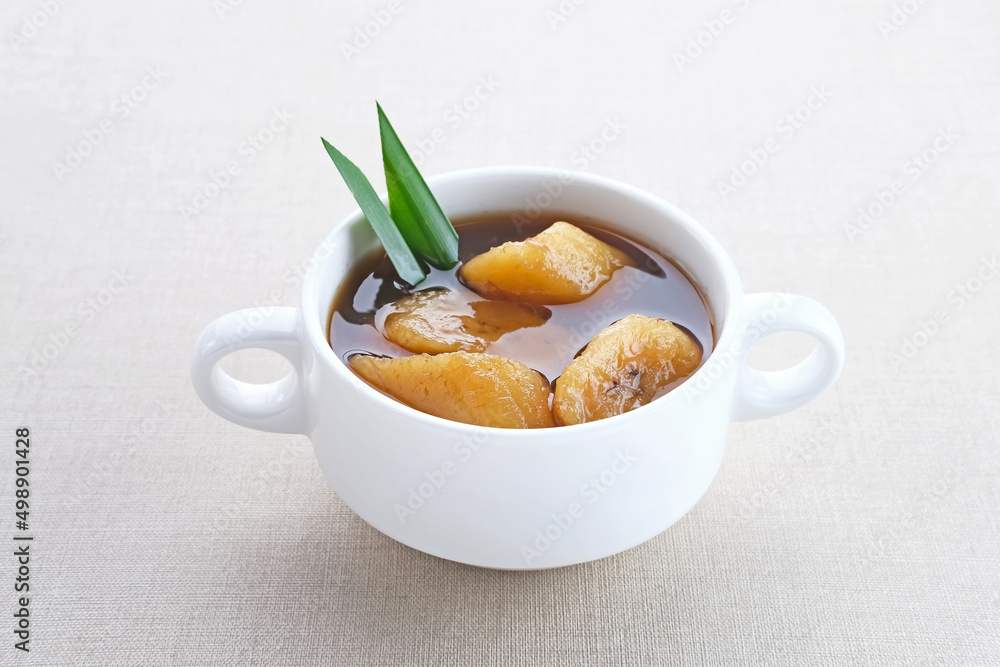 Setup Pisang is Indonesian traditional dessert made of banana, palm sugar boiled with cinnamon, pandan leaves and cloves.
Setup Pisang is Indonesian traditional dessert made of banana, palm sugar boiled with cinnamon, pandan leaves and cloves.