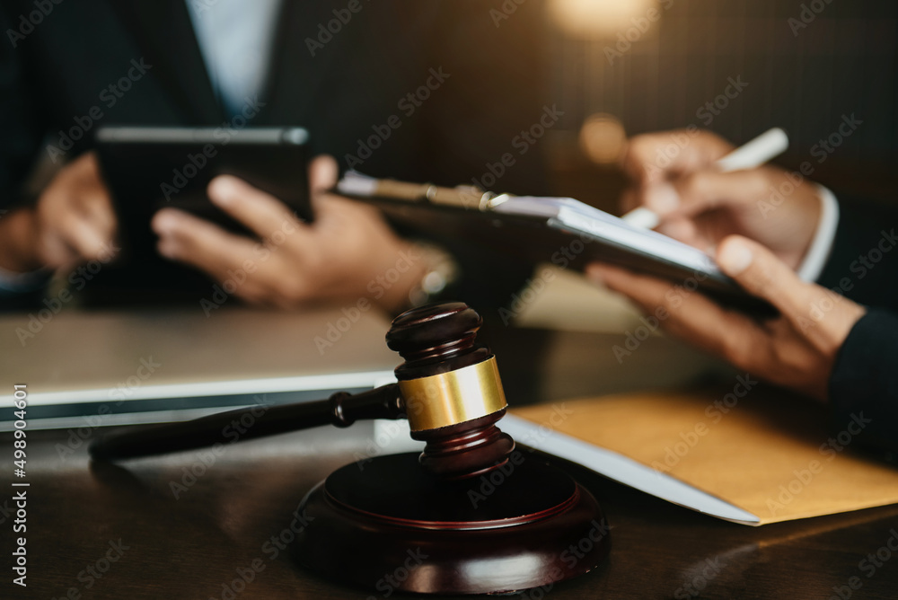 Lawyer or judge consult haveing team meeting at law office. Law and Legal services concept. Lawyer or judge consult haveing team meeting at law office. Law and Legal services concept.