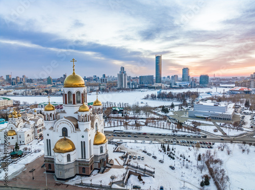 Winter Yekaterinburg and Temple on Blood in beautiful cloudy sunset. Aerial view of Yekaterinburg, Russia. Translation of the text on the temple: Honest to the Lord is the death of His saints.