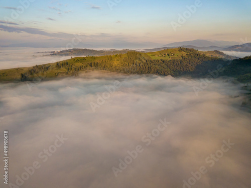 Morning fog in the Ukrainian Carpathians. Aerial drone view.