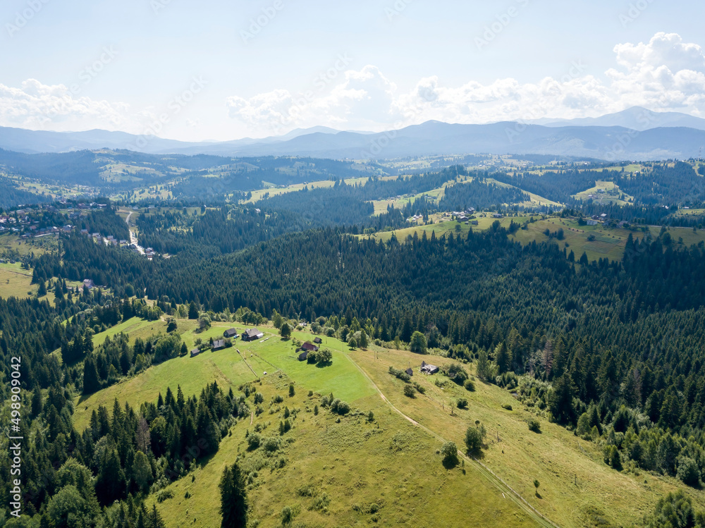 Green mountains of Ukrainian Carpathians in summer. Sunny day. Aerial drone view. Green mountains of Ukrainian Carpathians in summer. Sunny day. Aerial drone view.