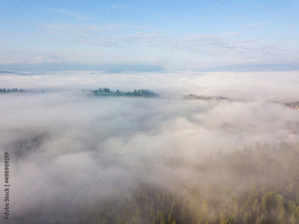 Morning fog in the Ukrainian Carpathians. Aerial drone view. Morning fog in the Ukrainian Carpathians. Aerial drone view.