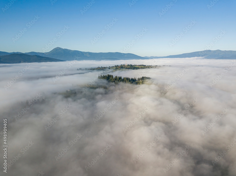 Morning fog in the Ukrainian Carpathians. Aerial drone view. Morning fog in the Ukrainian Carpathians. Aerial drone view.