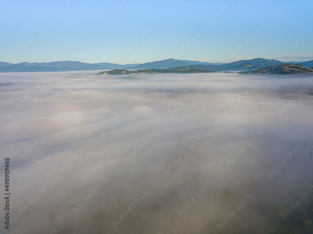 Morning fog in the Ukrainian Carpathians. Aerial drone view. Morning fog in the Ukrainian Carpathians. Aerial drone view.