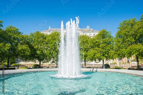 Fountain in park in center of Zagreb, Croatia, monumental architekcture in background