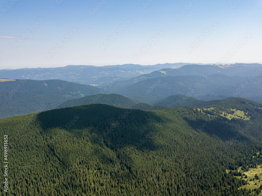 High mountains of the Ukrainian Carpathians in cloudy weather. Aerial drone view.