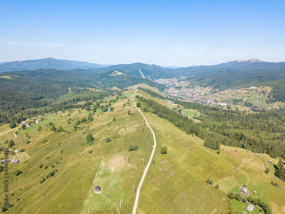 Green mountains of Ukrainian Carpathians in summer. Sunny clear day. Aerial drone view.