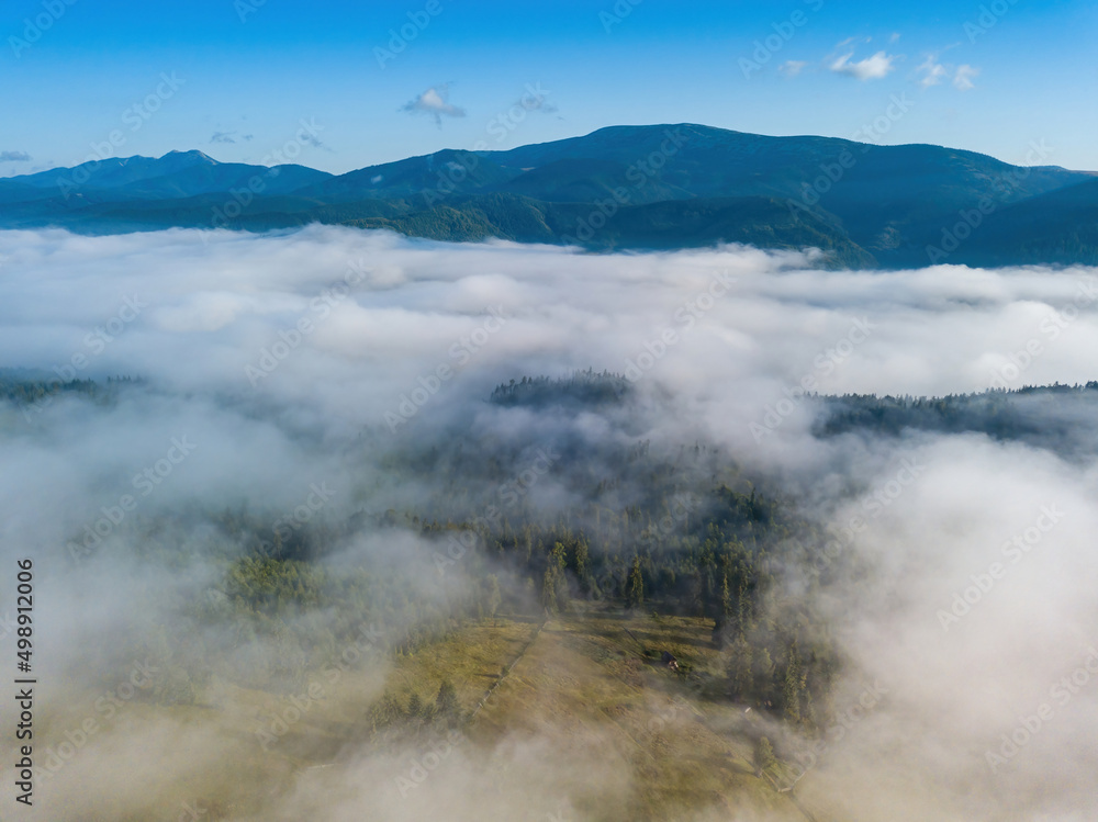 Foggy summer morning in the Ukrainian Carpathians. Aerial drone view. Foggy summer morning in the Ukrainian Carpathians. Aerial drone view.