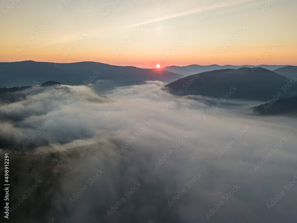 Sunrise over the fog in the Ukrainian Carpathians. Aerial drone view. Sunrise over the fog in the Ukrainian Carpathians. Aerial drone view.
