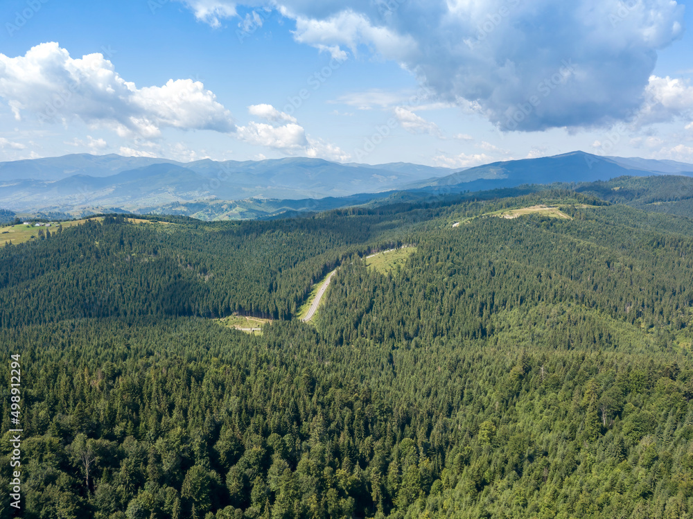Green mountains of Ukrainian Carpathians in summer. Sunny day. Aerial drone view. Green mountains of Ukrainian Carpathians in summer. Sunny day. Aerial drone view.