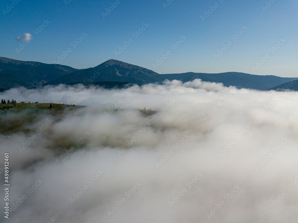 Morning fog in the Ukrainian Carpathians. Aerial drone view.