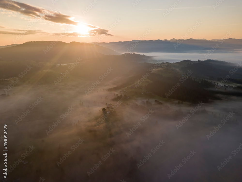 Sunrise over the fog in the Ukrainian Carpathians. Aerial drone view. Sunrise over the fog in the Ukrainian Carpathians. Aerial drone view.