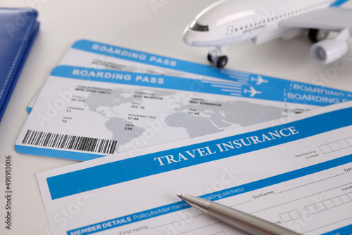 Obraz na płótnie Airplane tickets, empty travel insurance form with pen, fill in information w salonie