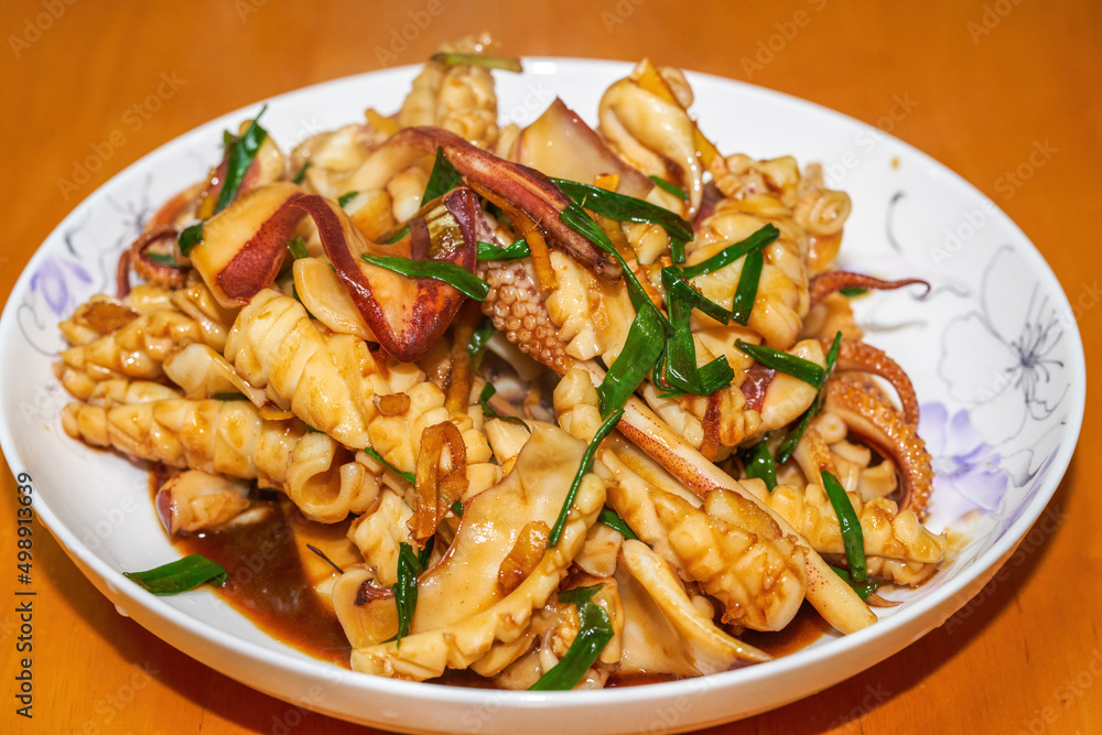 A delicious Chinese home-style dish, fried squid in sauce A delicious Chinese home-style dish, fried squid in sauce