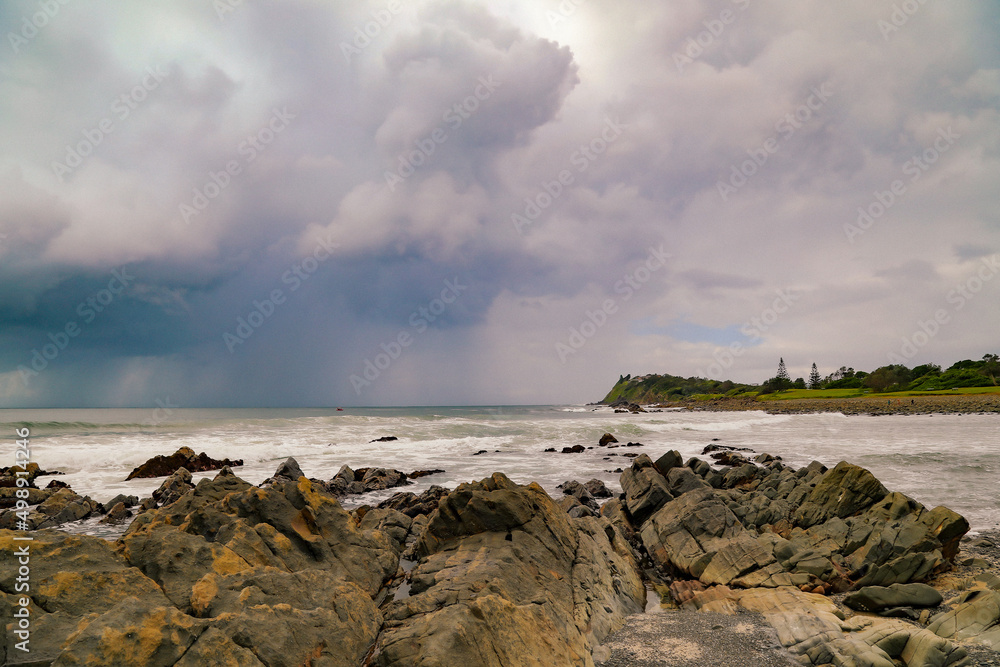 Pebbly Beach at Forster in NSW Australia with storm clouds in distance