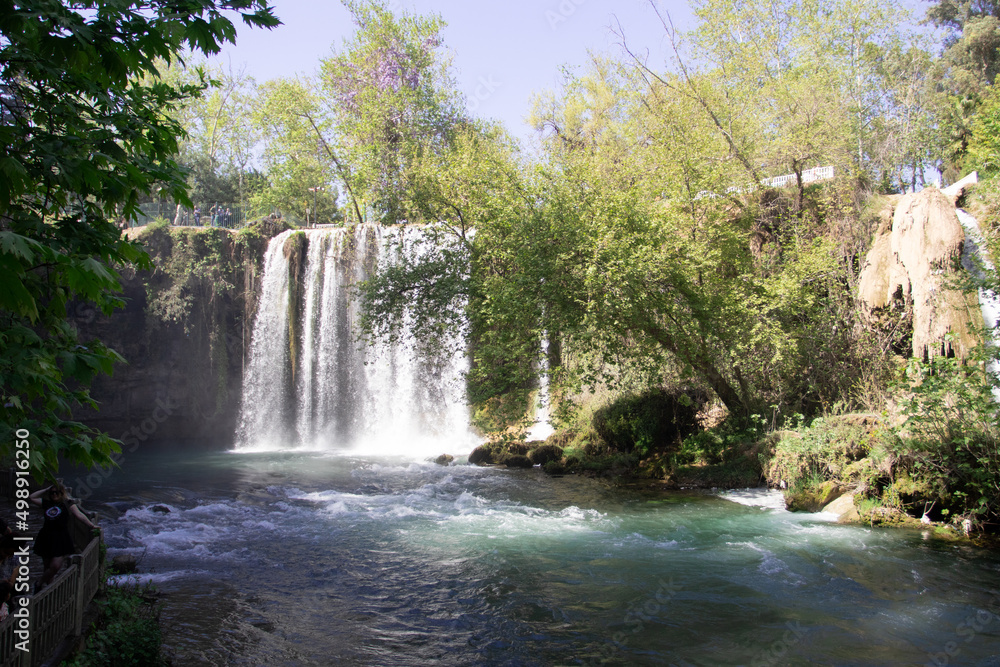 Obraz premium Big tropical nature waterfall at wild forest and lake