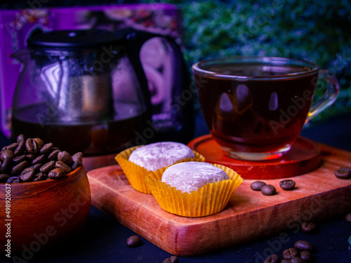 Photography Cozy evening with a cup of coffee and tasty soft Japanese mochi cakes