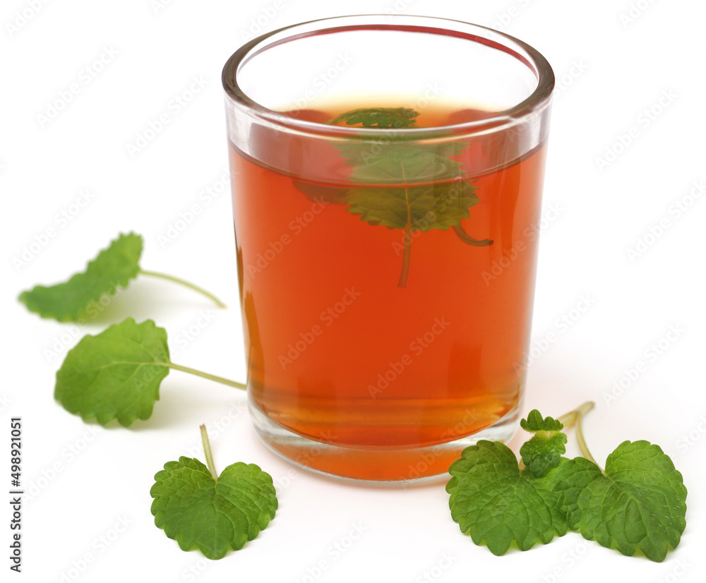Lemon balm leaves with herbal tea Lemon balm leaves with herbal tea