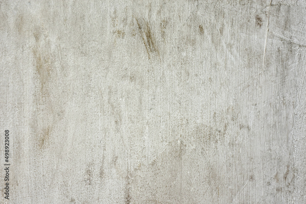 Texture of an old gray concrete wall with stains for the background.